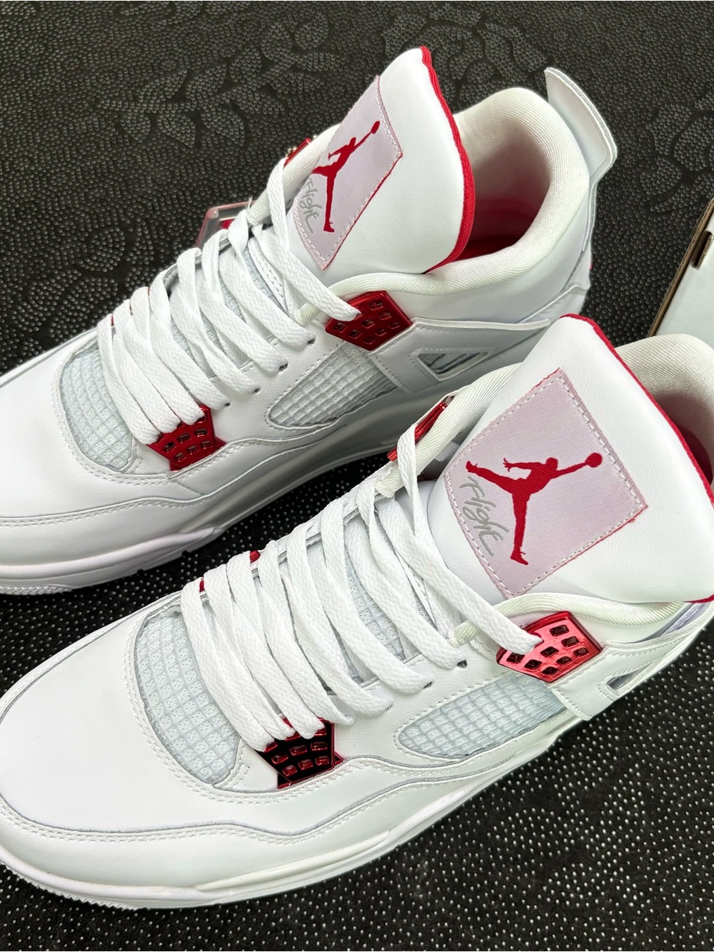 Jordan 4 Retro white and red sneakers